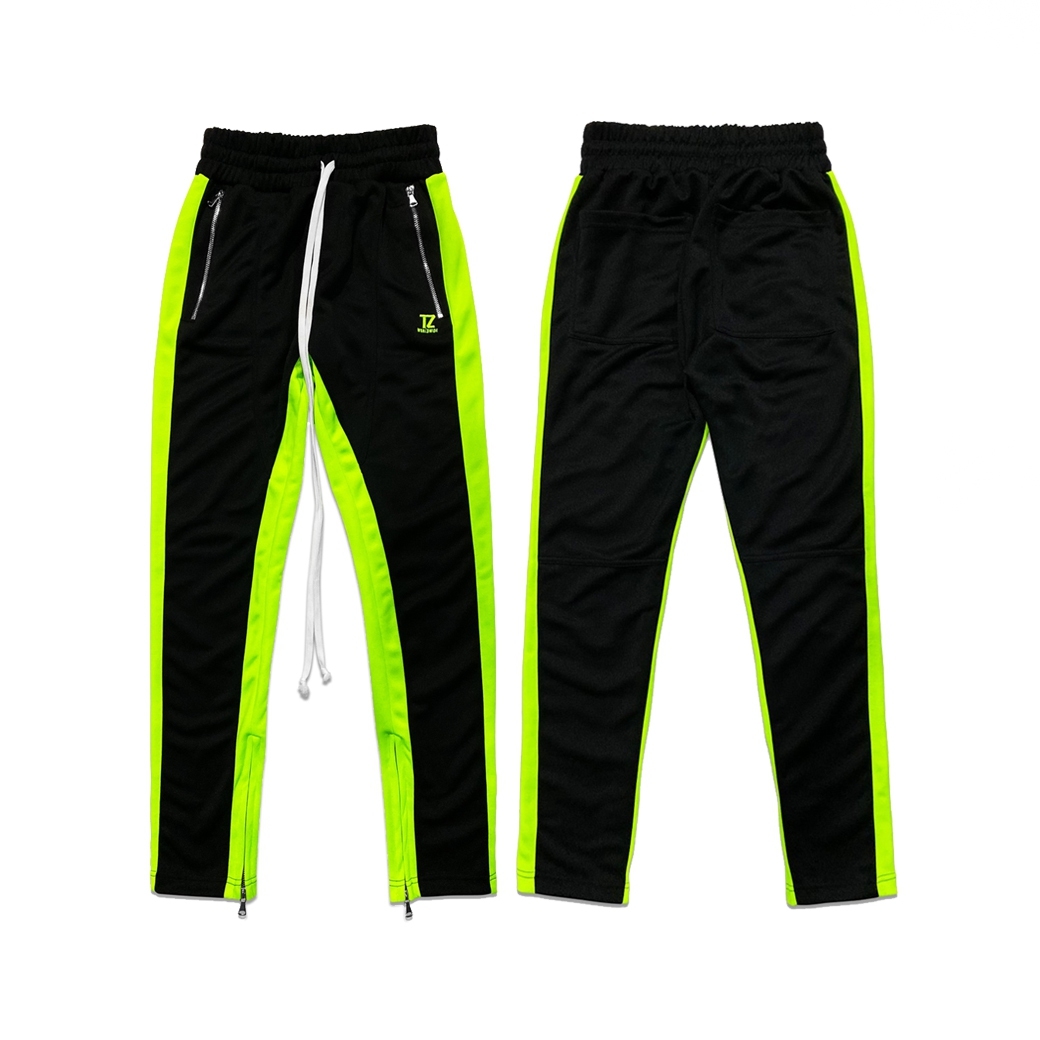 black and neon green track pants